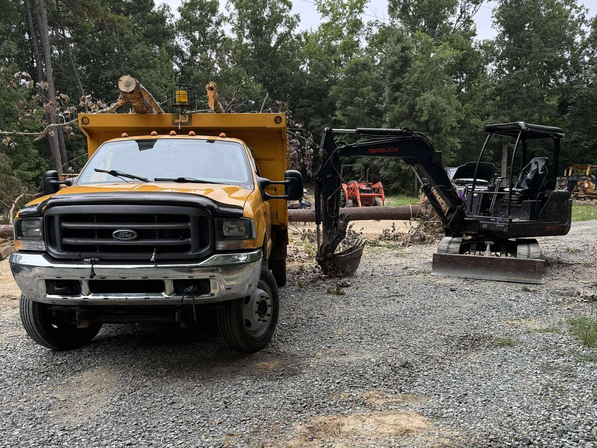 Dump truck and mini excavator ready for hauling work