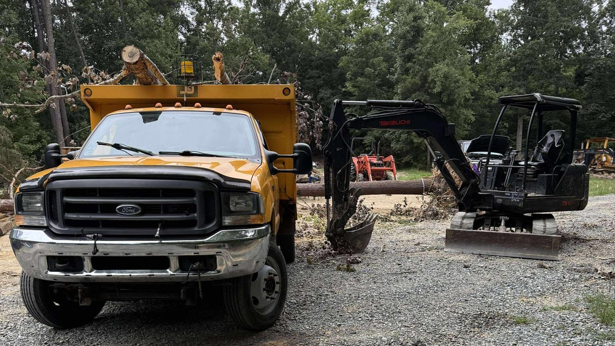 Dump truck and mini excavator for hauling and cleanup work